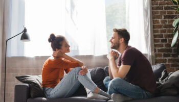 couple looking thoughtful, representing relationship anxiety